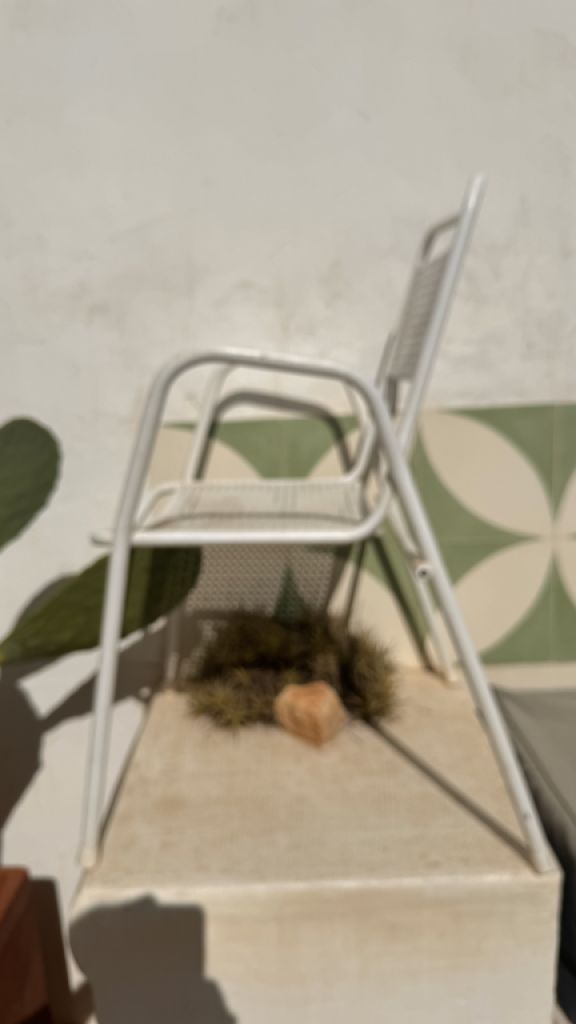 2 metal chairs with typical perforated sheet metal