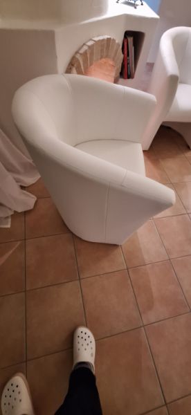 White faux leather cocktail armchairs