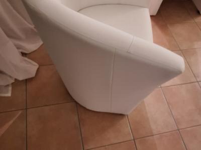 White faux leather cocktail armchairs