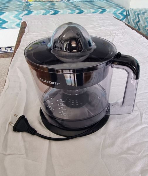 Electric juice press, citrus juicer, available.