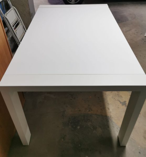 White solid wood extendable dining table