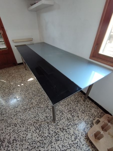 Glass table with stainless steel base