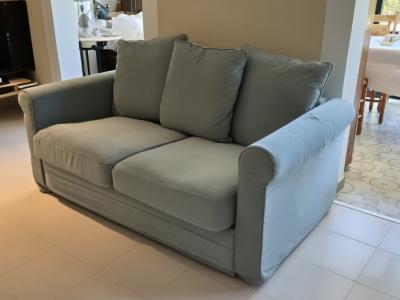Green 2‑seater sofa like new"!