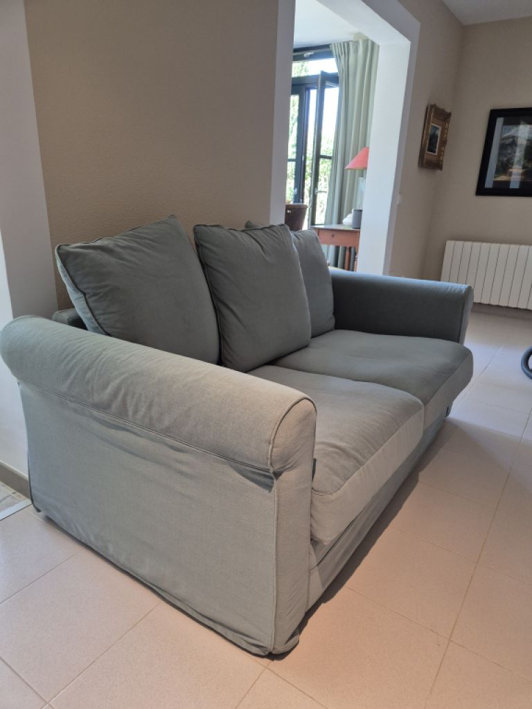 Green 2‑seater sofa like new"!