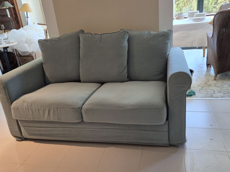 Green 2‑seater sofa like new"!