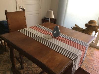 Wooden dining table with two leather chairs
