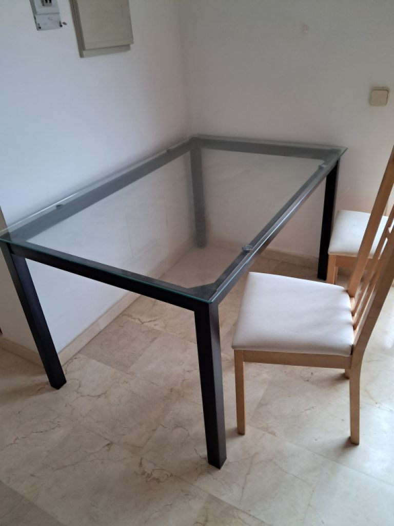 Metal table with glass top