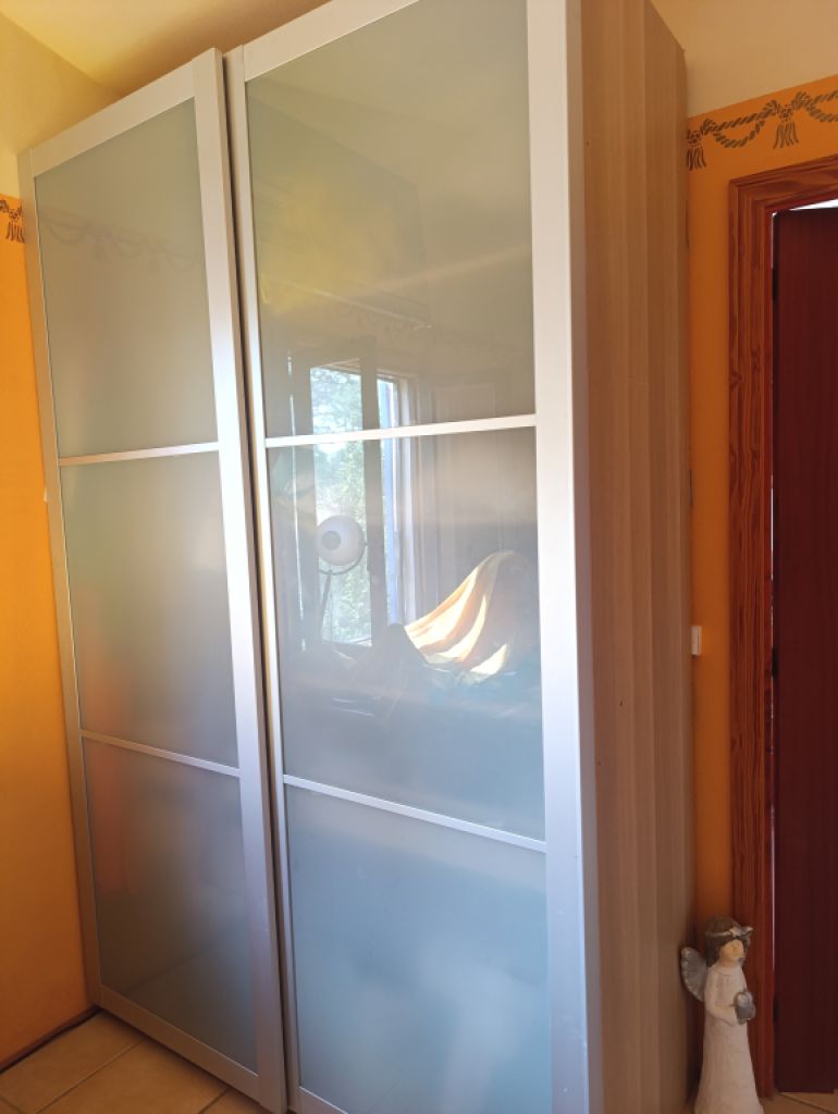 PAX wardrobe with glass sliding doors