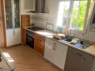 Beautiful kitchen with electrical appliances, stone countertop