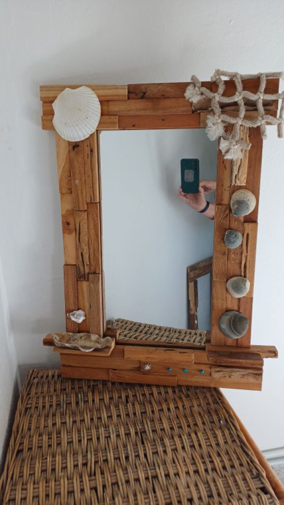 Mirror with wooden frame, driftwood and shells