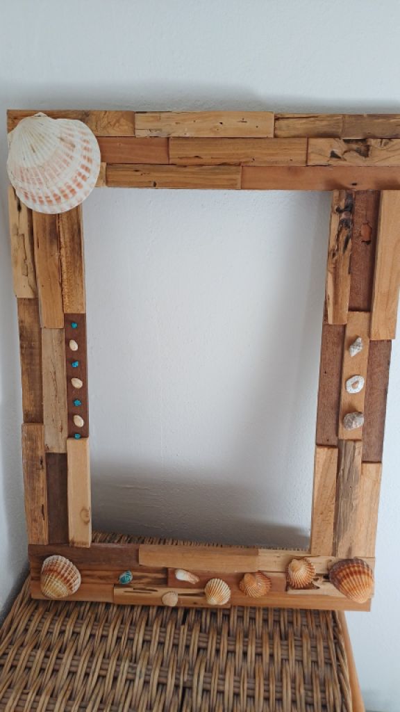 Mirror with wooden frame, driftwood and shells