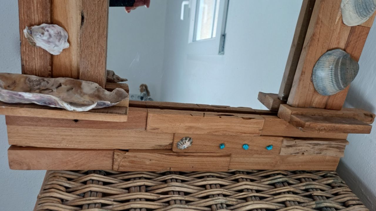Mirror with wooden frame, driftwood and shells