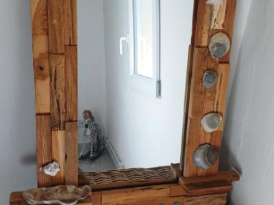 Mirror with wooden frame, driftwood and shells