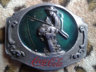 various Coca-Cola belt buckles