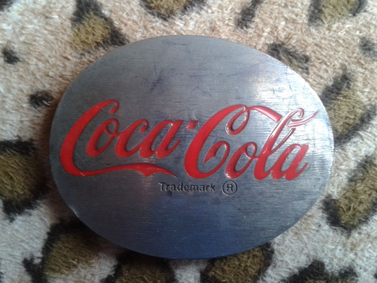 various Coca-Cola belt buckles