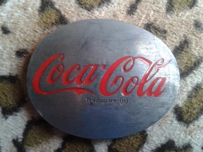various Coca-Cola belt buckles